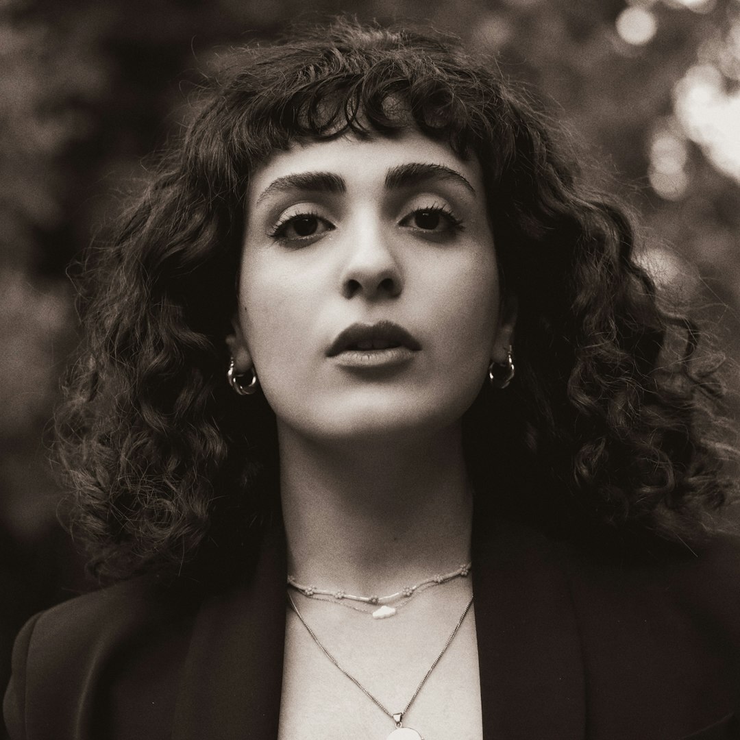 Professional portrait of a woman with brown hair in professional attire