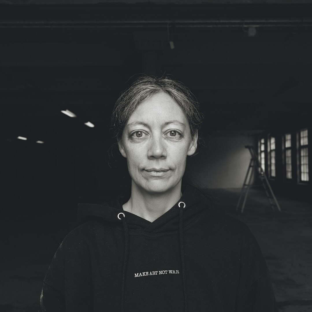 Professional portrait of a Swedish woman with blonde hair in business attire