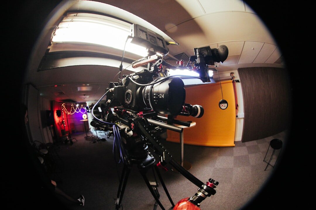 Professional broadcast camera on tripod in studio